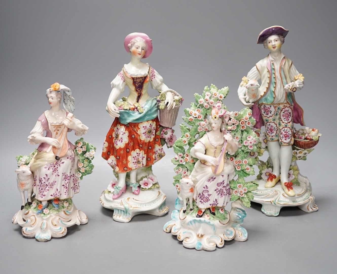 Four late 18th century Derby figures of a shepherd, a flower seller and two lute players - tallest 26cm